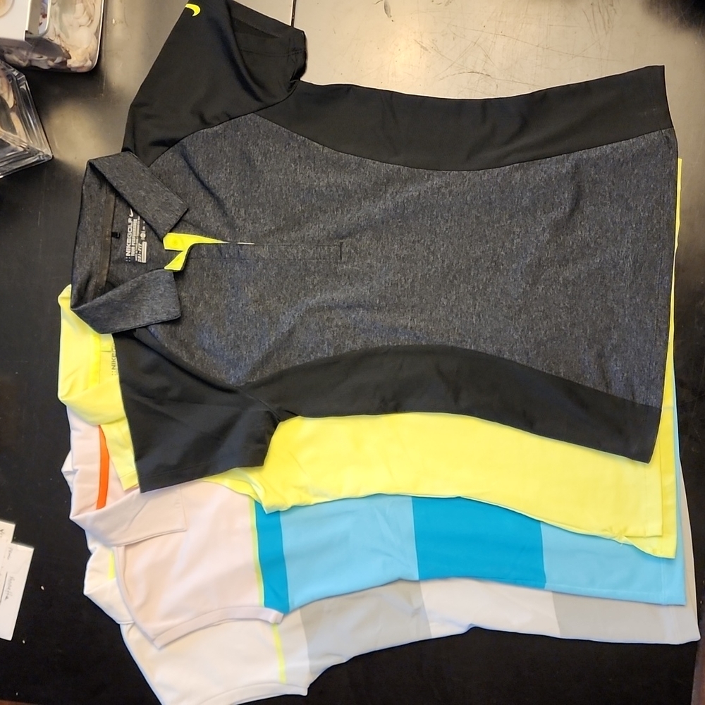 Four XS Nike Golf Polos